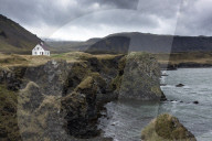 Lone white house among the sea stacks and moutains at Arnastapi, Snaefellsnes Peninsula, Iceland