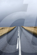 Road stretching away towards stormy sky, Snaefellsnes Peninsula, Iceland