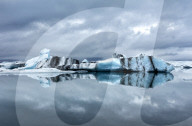 Icebergs and reflections on Jokulsarlon glacial lagoon, South Iceland