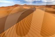 Wide angle view of the ripples and dunes of the Erg Chebbi Sand sea, part of the Sahara Desert near Merzouga, Morocco