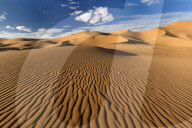 Wide angle view of the ripples and dunes of the Erg Chebbi Sand sea, part of the Sahara Desert near Merzouga, Morocco