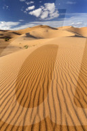 Wide angle view of the ripples and dunes of the Erg Chebbi Sand sea, part of the Sahara Desert near Merzouga, Morocco