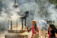 Burning incense at Po Lin Monastery, Ngong Ping, Lantau Island, Hong Kong, China, Asia