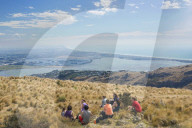 Group of young people enjoying a picnic on the Port Hills, Christchurch, Canterbury, South Island, New Zealand, Pacific