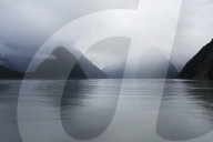 View down rainswept Milford Sound, mountains obscured by cloud, Milford Sound, Fiordland National Park, UNESCO World Heritage Site, Southland, South Island, New Zealand, Pacific