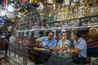 Bazaaris chatting after work, Azadegan Tea House, Isfahan, Iran