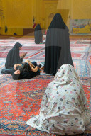 Women and child gathered, interior, Aramgah-e Shah-e Cheragh (Mausoleum of the King of Light), Shiraz, Iran