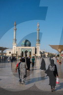 Astane Square in front of the Imam Hassan Mosque, unusually challenging message (Can't Get No Satisfaction) on girl's ba