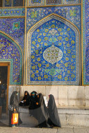Girls gossiping after shopping in the Grand Bazaar, by entrance of Sheikh Lotfollah Mosque, Isfahan, Iran