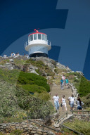 Tourist climbing up and down steps to visit the lighthouse at Cape Point, Cape Town, South Africa