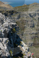 Two climbers descending from the top of Table Mountain, Cape Town, South Africa