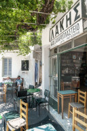 Forecourt of traditional cafe , Apollonia, capital of Sifnos, Cyclades Islands, Greece