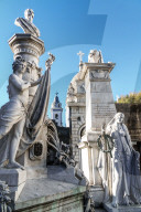 Statues at the entrance to vaults in La Recoleta Cemetery, which lies right in the heart of the city, Buenos Aires, Argentina