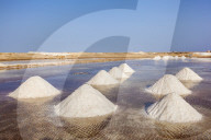 Piles of salt collected from natural salt pans at Salinas, just outside Santa Maria, Sal island, Cape Verde, Africa