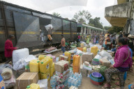 Africa, eastern Madagascar, Fianarantsoa to Manakara FCE train, cargo being unloaded