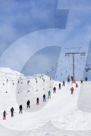 Europe, The Alps, Switzerland, Valais, 4 Vallees, Veysonnaz (Verbier), skiers on a drag lift