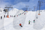 Europe, The Alps, Switzerland, Valais, 4 Vallees, Veysonnaz (Verbier), skiers on a drag lift