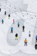 Europe, The Alps, Switzerland, Valais, 4 Vallees, Veysonnaz (Verbier), skiers on a drag lift