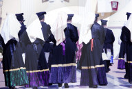 Men & Women in a traditional costume during the Saint Antioco procession Sardinia