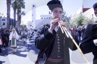 Playng the Launeddas during the Saint Antioco parade\ procession