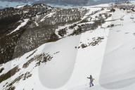 Young skier skiing down The Chute & Mt Hotham Village, Mt Hotham, Victoria.