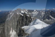 Climbers on a snowfield approaching the Auguile du Midi, 3842m, Graian Alps, Chamonix, France