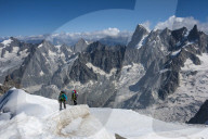 Climbers approaching the 'Tunnel' to the Aiguile du Midi, 3842m, Graian Alps, Chamonix, France