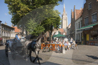 Square with Cafe, Horse and Carraige, and Spire of Church of Our Lady, Bruges, Belgium