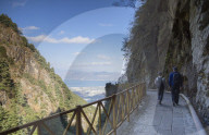 Couple hiking in Cang Mountains, Dali, Yunnan, China (MR)