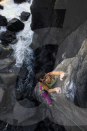 A woman rock climbing on the Jogasaki Coast, Izu Peninsula, Honshu, Japan, Asia