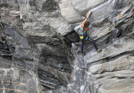 A climber scales a difficult route in the Hanshallaren Cave, Flatanger, Norway