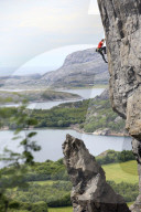 A climber scales a difficult route in the Hanshallaren Cave, Flatanger, Norway