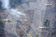 Workers' huts on Naga hillside being desecrated by the govenment slash and burn system to improve soil for agriculture, Nagaland