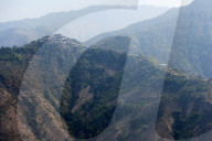 One of the countless hilltop Naga villages in the verdant Naga hills, Baptist church at its peak, Nagaland