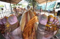 Ardhanarishvara, androgynous form of Lord Shiva, prostrate statue in temple, Auroville, Pondicherry, Tamil Nadu