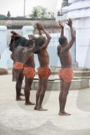 Joranda monks in saffron loincloths performing daily sunset devotional prayer ceremony at Joranda monastery, Odisha