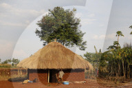 Ugandan child outside his home.