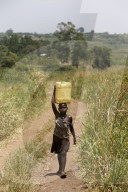 Ugandan child fetching water.