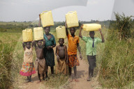 Ugandan children fetching water.