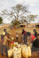 Water chore in a Ugandan village.