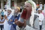 Ajmer Sharif dargah, Rajasthan. Faithful turning towards the main shrine in the evening. India.