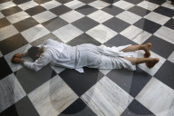 Devotee prosternating at Krishna-Balaram temple, Vrindavan, Uttar Pradesh. India.