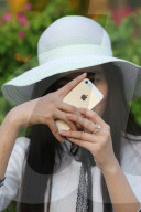 Woman taking picture with a smartphone. Vietnam.