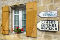 Shuttered window & signs in this old village on the Dropt River near Duras. Allemans-du-Dropt; Lot-et-Garonne; Aquitaine, France
