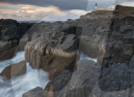 The dramatic coastline and lighthouse at Neist Point, Isle of Skye, Scotland.