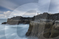 The dramatic coastline and lighthouse at Neist Point, Isle of Skye, Scotland.