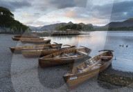 Pleasure boats on the shore at Derwentwater, Cumbria, England.