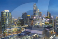 City skyline at dusk from hotel rooftop bar, Bangkok, Thailand, Southeast Asia, Asia