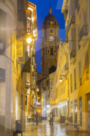 View of Malaga Cathedral from Calle Marques de Larios at dusk, Malaga, Costa Del Sol, Andalusia, Spain, Europe
