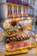 View of tradition Spanish Tapas overlooking Plaza del Siglo at dusk, Malaga, Costa Del Sol, Andalusia, Spain, Europe